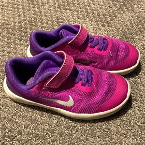 Pink & purple Nikes- easy to slip on/off for kids not tying shoes yet.